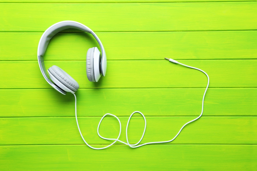 White-Headphones-on-Green-Background
